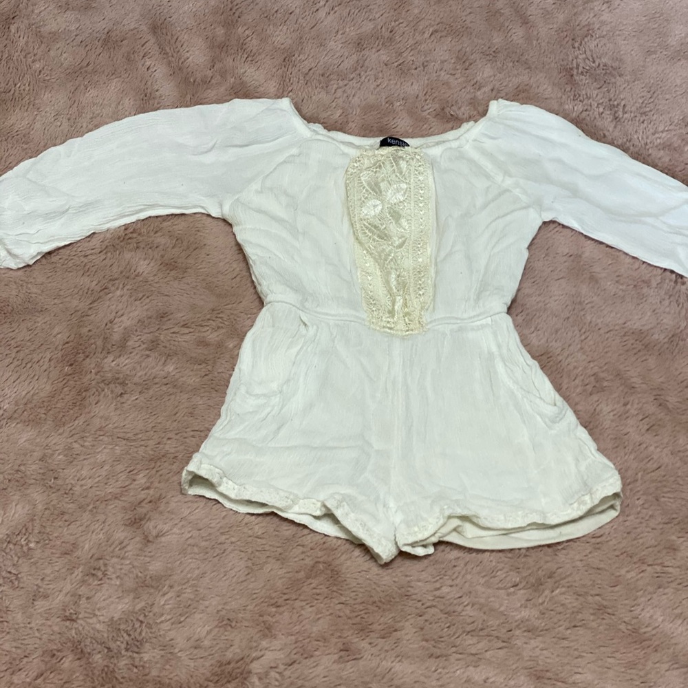 Stylish off white romper.